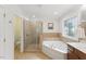 Stylish bathroom features a bathtub, glass shower, and tiled accents at 776 Legend Oaks Dr, Chapel Hill, NC 27517