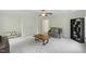 Bright bonus room with plush carpet, a comfortable sofa, and a decorative storage shelf, ideal for a den or playroom at 776 Legend Oaks Dr, Chapel Hill, NC 27517