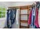 Walk-in closet features custom wooden shelving and plenty of storage space at 776 Legend Oaks Dr, Chapel Hill, NC 27517