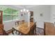 Formal dining room with a chandelier, large table, and classic furnishings, perfect for entertaining at 776 Legend Oaks Dr, Chapel Hill, NC 27517