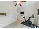 Clean, carpeted exercise room features stationary bike, closet, and a flat screen television at 776 Legend Oaks Dr, Chapel Hill, NC 27517