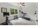 Light-filled exercise room with a treadmill, exercise bike, weights and a large window at 776 Legend Oaks Dr, Chapel Hill, NC 27517