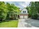 Beautiful two-story home with a brick and vinyl exterior, complemented by a well-manicured lawn at 776 Legend Oaks Dr, Chapel Hill, NC 27517