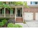 Close-up of a welcoming front porch with brick steps and decorative potted plants at the front door at 776 Legend Oaks Dr, Chapel Hill, NC 27517