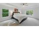 Serene main bedroom with tray ceilings, plush carpeting, and abundant natural light from large windows at 776 Legend Oaks Dr, Chapel Hill, NC 27517