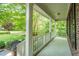 Inviting front porch with classic white columns and a patterned floor, providing a relaxing outdoor space at 776 Legend Oaks Dr, Chapel Hill, NC 27517