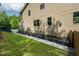 This home has a well-maintained side yard with a lawn, garden beds, and mature trees for privacy and beauty at 776 Legend Oaks Dr, Chapel Hill, NC 27517