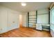 Bedroom features hardwood floors, storage, and natural light at 803 Churchill Dr, Chapel Hill, NC 27517