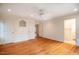 Spacious bedroom offers natural lighting, hardwood flooring, a ceiling fan, and built in storage at 803 Churchill Dr, Chapel Hill, NC 27517