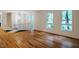 Hardwood floors, staircase, and lots of natural light in the beautifully designed living room at 803 Churchill Dr, Chapel Hill, NC 27517