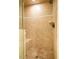 Beautiful tiled shower with built-in seat and shower head at 803 Churchill Dr, Chapel Hill, NC 27517