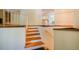 An interior staircase featuring wood steps and white railings at 803 Churchill Dr, Chapel Hill, NC 27517