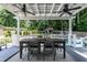 Spacious back deck with dining table and wooded view. Great for outdoor entertaining at 813 Faulkner Pl, Raleigh, NC 27609