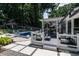 Backyard featuring a pool, a deck with dining, and lounge area with beautiful landscaping at 813 Faulkner Pl, Raleigh, NC 27609