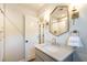 Bathroom vanity boasts marble countertop, white sink, and decorative lighting at 813 Faulkner Pl, Raleigh, NC 27609
