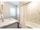 Beautiful bathroom featuring stylish tile work, a marble countertop, and modern fixtures at 813 Faulkner Pl, Raleigh, NC 27609