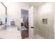 Sleek bathroom featuring a glass shower, modern fixtures, and a neutral color scheme with access to bedroom at 813 Faulkner Pl, Raleigh, NC 27609