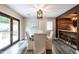Dining area with stylish light fixture, seating for five, and adjacent to an outdoor space at 813 Faulkner Pl, Raleigh, NC 27609