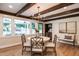 Cozy dining room with ample natural light, built-in shelving, and backyard views at 813 Faulkner Pl, Raleigh, NC 27609