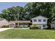 Charming two-story home with well-manicured lawn, lush landscaping and attached garage at 813 Faulkner Pl, Raleigh, NC 27609
