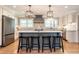 Modern kitchen with a large island, stainless steel appliances, and stylish backsplash at 813 Faulkner Pl, Raleigh, NC 27609