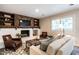 Inviting living room featuring a white-painted brick fireplace, and cozy seating at 813 Faulkner Pl, Raleigh, NC 27609