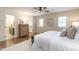 Bright main bedroom with hardwood floors, natural light, and an en-suite bathroom and walk-in closet at 813 Faulkner Pl, Raleigh, NC 27609