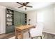 Bright office with a custom built-in, wood desk, ceiling fan, and natural light at 813 Faulkner Pl, Raleigh, NC 27609