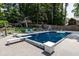 Backyard pool features diving board, basketball goal and plenty of patio space for entertaining friends and Gathering at 813 Faulkner Pl, Raleigh, NC 27609