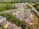 Aerial view of a well planned community featuring lush trees and landscaping, and well spaced homes on quiet cul-de-sacs at 829 Churton Pl, Cary, NC 27518