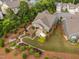 An aerial shot displays the backyard's landscaping and patio shaded by the pergola at 829 Churton Pl, Cary, NC 27518