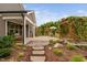 Inviting backyard featuring a pergola with climbing plants and a cozy covered patio at 829 Churton Pl, Cary, NC 27518