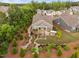 Aerial view of a backyard featuring a landscaped design with a pergola-covered patio and outdoor kitchen at 829 Churton Pl, Cary, NC 27518