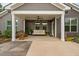 Covered backyard patio with neutral colored furniture and a ceiling fan at 829 Churton Pl, Cary, NC 27518