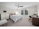 Bright bedroom featuring carpet, a ceiling fan, and natural light at 829 Churton Pl, Cary, NC 27518