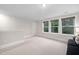 Spacious bonus room with large windows providing natural light at 829 Churton Pl, Cary, NC 27518