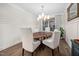Sophisticated dining room with natural wood table and decorative light fixture with natural lighting at 829 Churton Pl, Cary, NC 27518