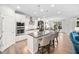 Well-appointed kitchen featuring a central island, a dining table, and modern appliances for everyday living at 829 Churton Pl, Cary, NC 27518