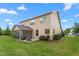 Exterior view of a two-story home with a well-maintained lawn and a screened-in porch at 839 Old Towne Dr, Elon, NC 27244