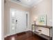 Elegant foyer with hardwood floors, decorative front door with glass and a stylish console table at 839 Old Towne Dr, Elon, NC 27244