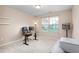 Office with desk, carpeted floor, and window, providing a comfortable workspace at 839 Old Towne Dr, Elon, NC 27244