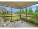 Relaxing screened porch with decorative items and views of the manicured backyard at 839 Old Towne Dr, Elon, NC 27244