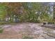 Expansive backyard featuring a mix of brick patios and blossoming landscaping at 8608 Cheerful Ct, Raleigh, NC 27615