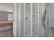 Modern bathroom showing glass enclosed shower with a view into a neutral colored bedroom at 8608 Cheerful Ct, Raleigh, NC 27615