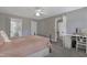 Bedroom featuring a bed, desk, and natural light creates a comfortable and functional living space at 8608 Cheerful Ct, Raleigh, NC 27615