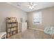 Comfortable bedroom with a cozy chair, a window with natural light, and playful decorations at 8608 Cheerful Ct, Raleigh, NC 27615