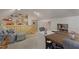 Upstairs bonus room features a charming sitting area, workspace, and ample storage shelves at 8608 Cheerful Ct, Raleigh, NC 27615