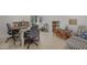 Bright bonus room with dual workspaces, built-in shelves and charming decor at 8608 Cheerful Ct, Raleigh, NC 27615