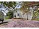 Rear view of the home showcasing a patio, manicured lawn, and well-maintained landscaping at 8608 Cheerful Ct, Raleigh, NC 27615