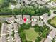 Aerial view of the neighborhood showcasing mature trees, pond and the home's location within at 8722 Macedonia Lake Dr, Cary, NC 27518